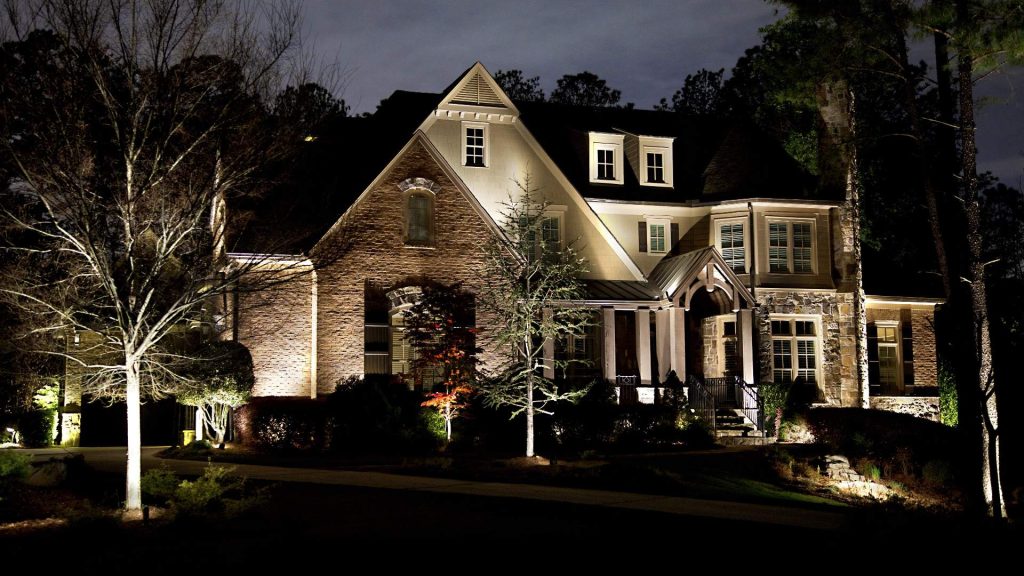 house with landscape accent lighting