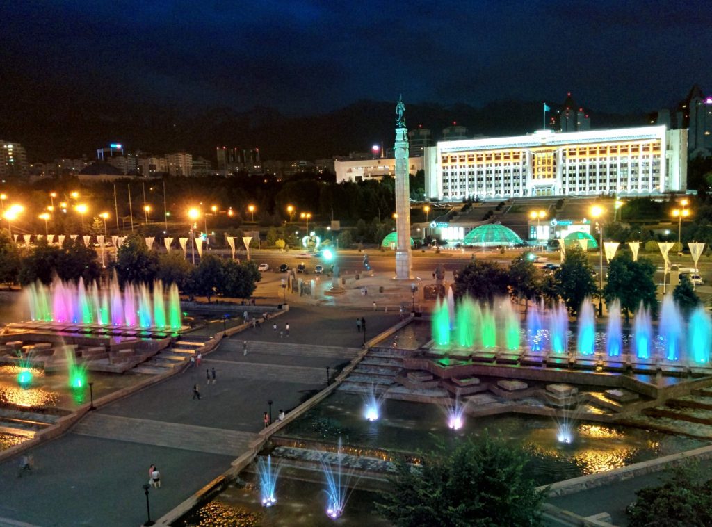 artificially lit buildings, streets and park
