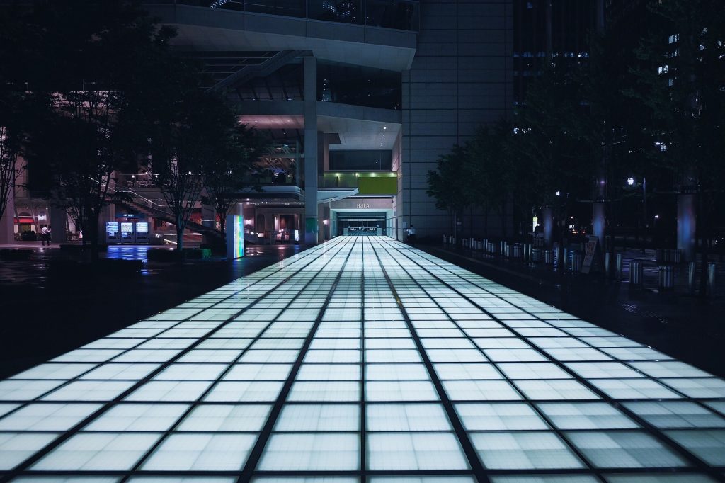 landscape ground lighting in front of a building