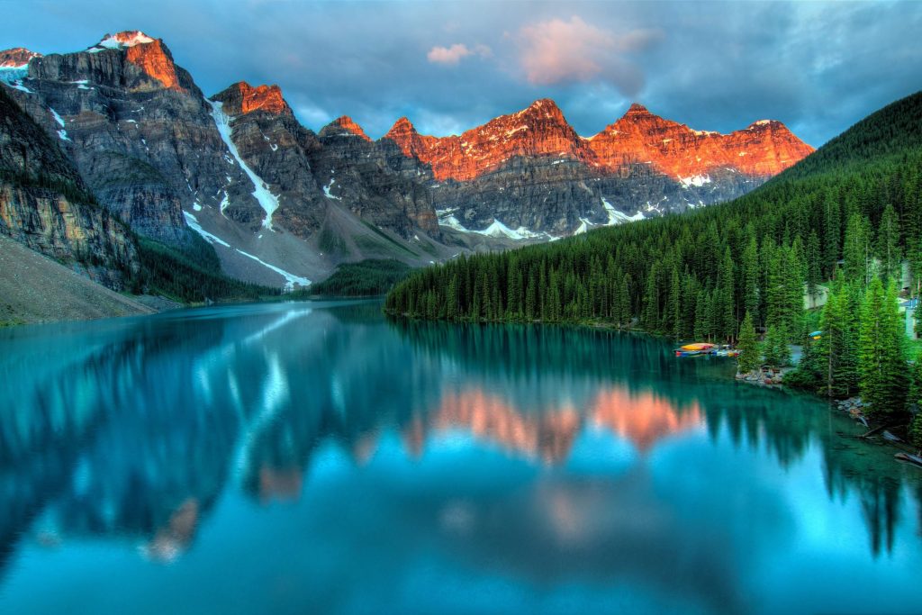 naturally lit landscape in high mountains with lake and trees