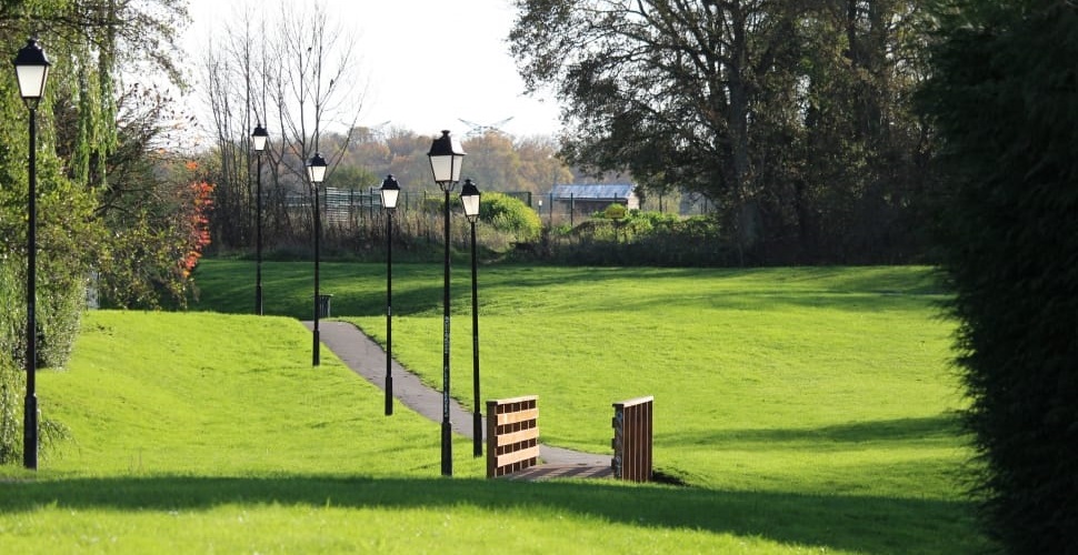 lantern style lights on poles in pathway