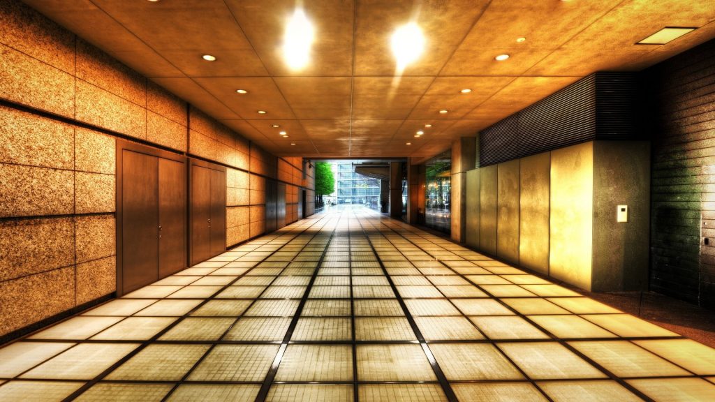 recessed lighting fixtures in the lobby of a building
