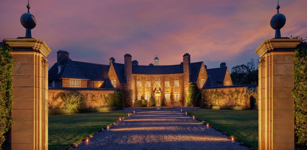 landscape uplighting on a mansion