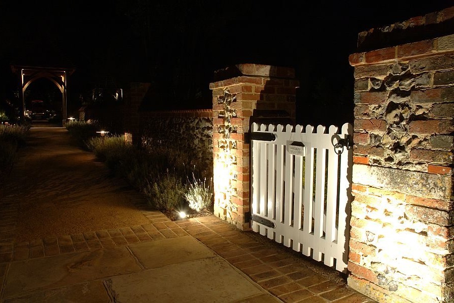 landscape cross lighting on the entrance gate