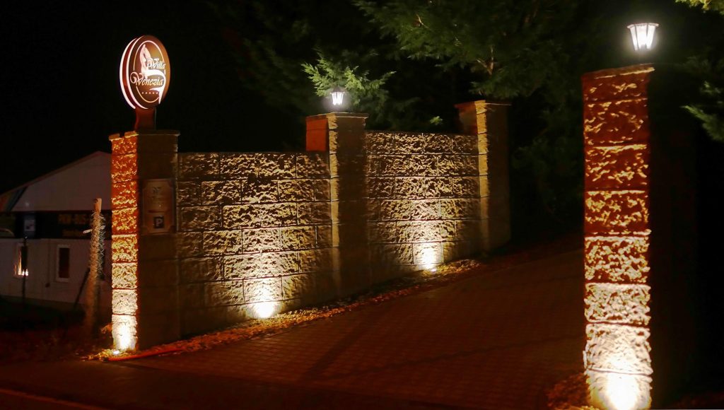 uplights on the fence walls
