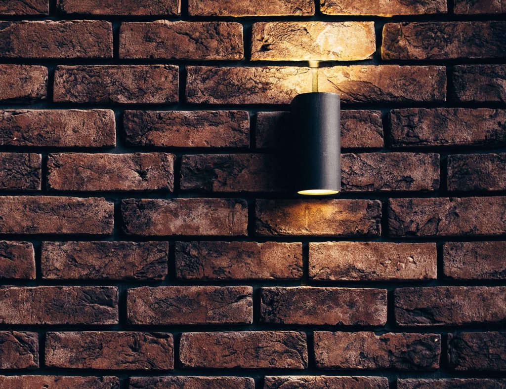 grazing lighting on brick wall