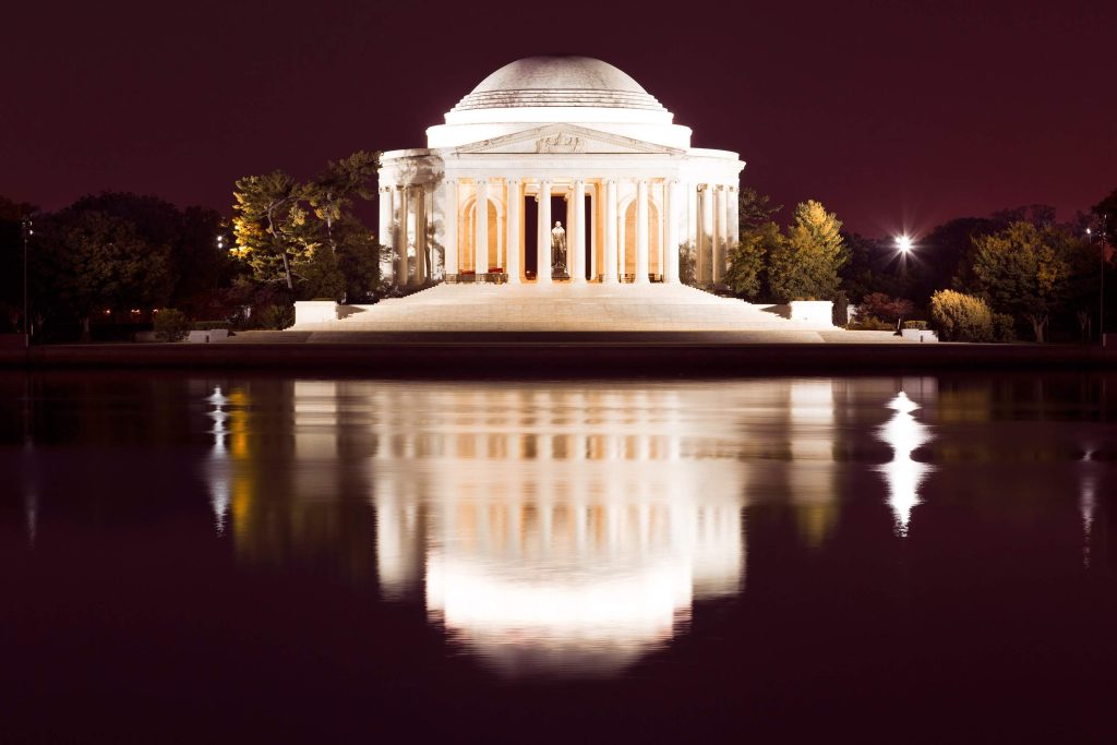 illuminated building near the water