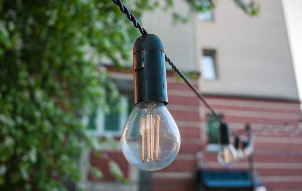 string retrofit lights; how to hang outdoor string lights from house to fence