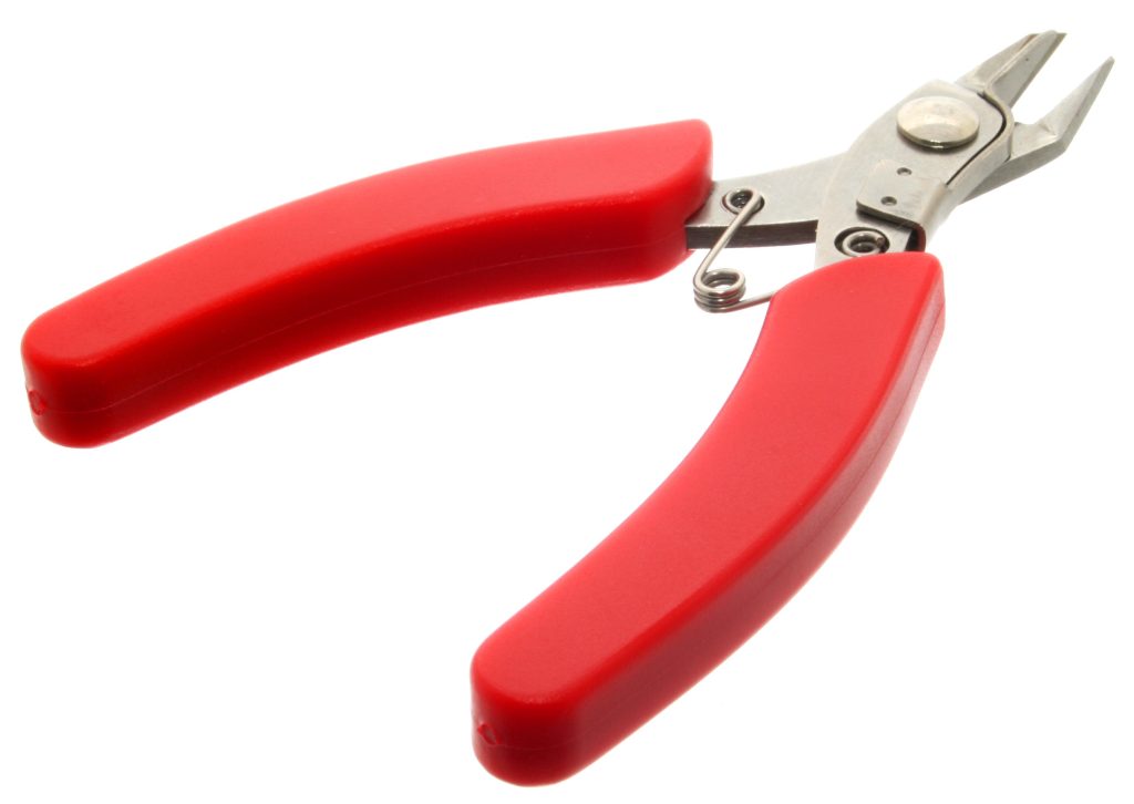 wire cutters; how to attach string lights to the house