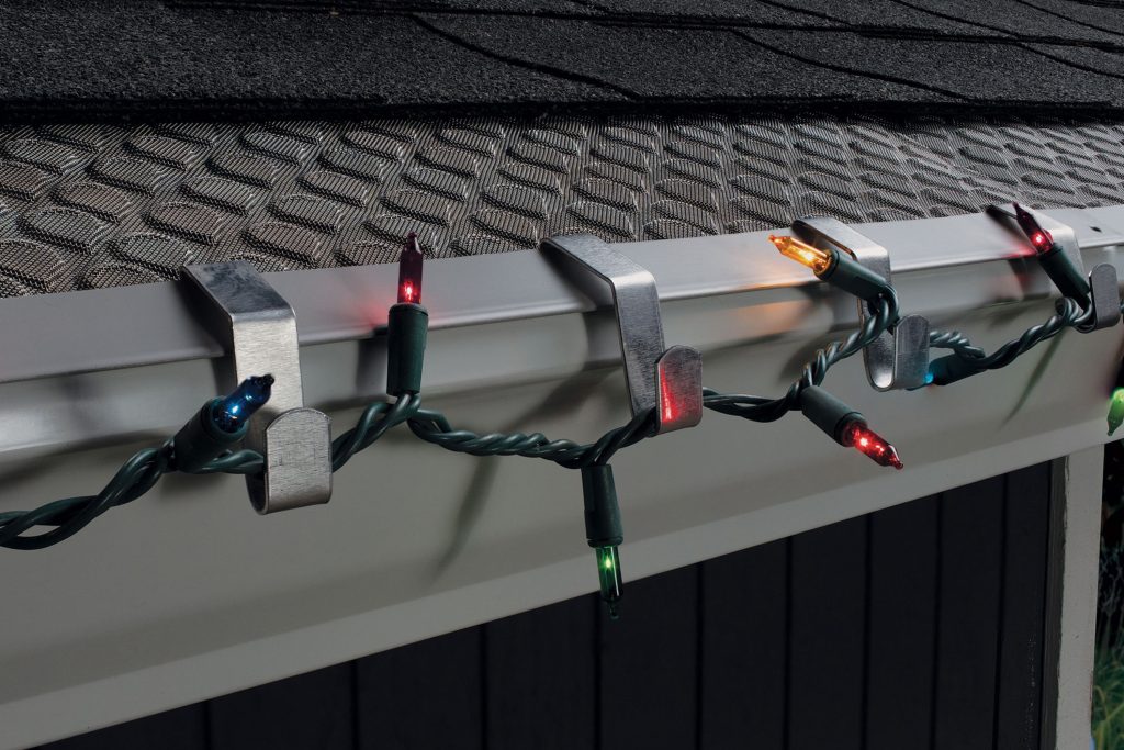 string lights on eavestroughs; metal gutter hooks; how to hang outdoor string lights on metal structures