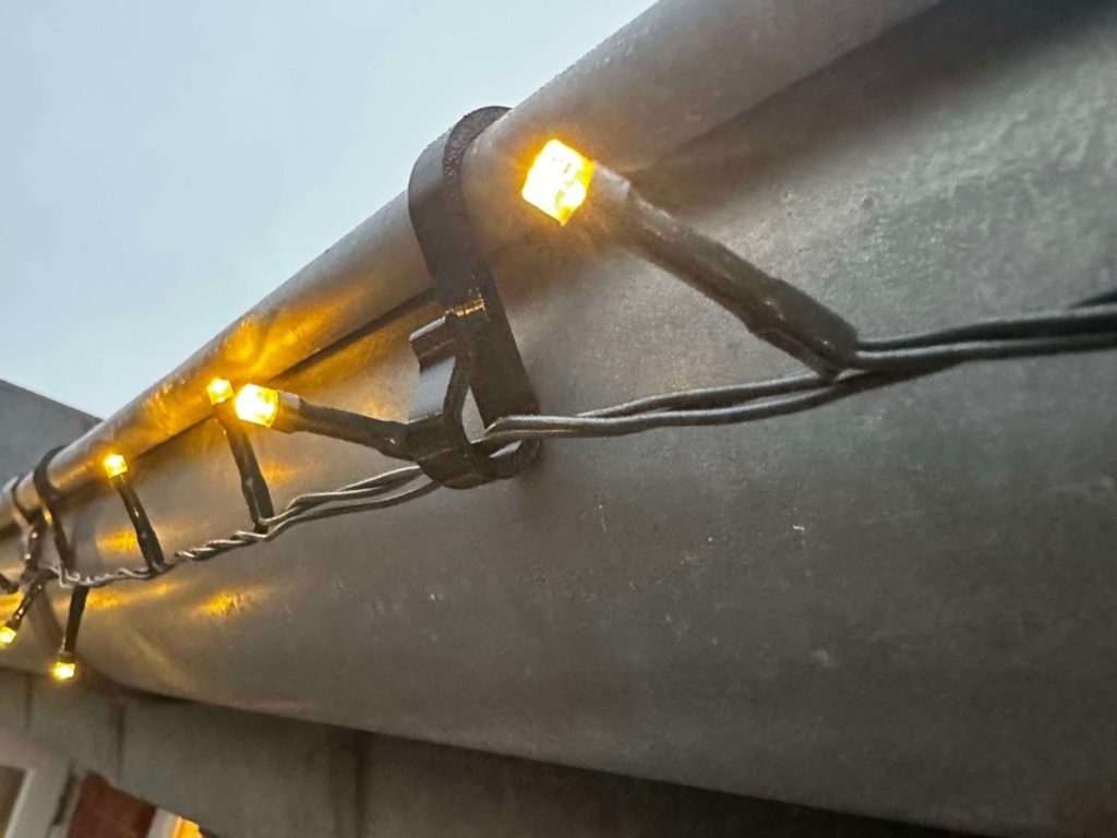 string lights on gutters; plastic gutter hooks
